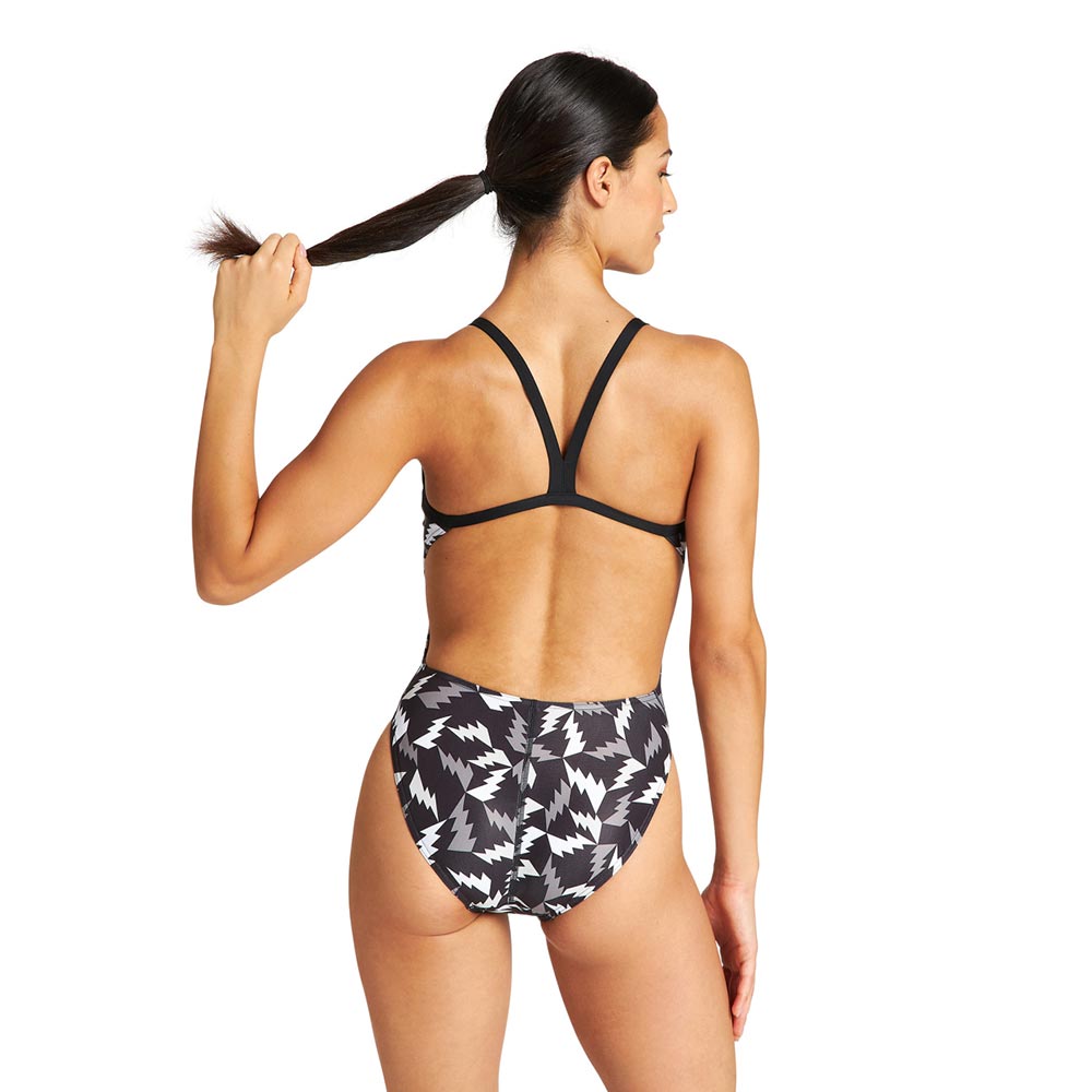 Back view of the arena womens lightning swimsuit with lightning bolt pattern in black and white.