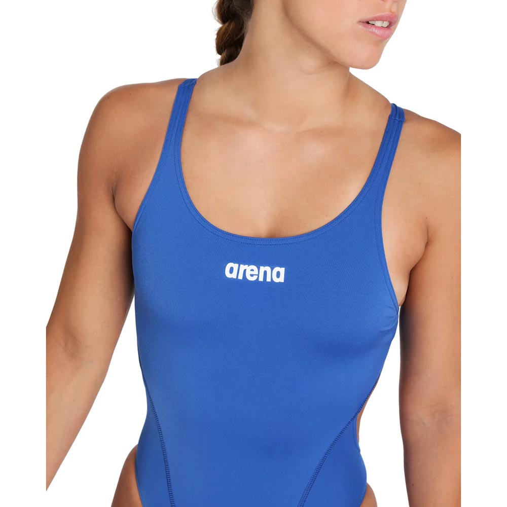Close up of the royal blue arena womens team swimsuit with arena logo printed in white on the chest.