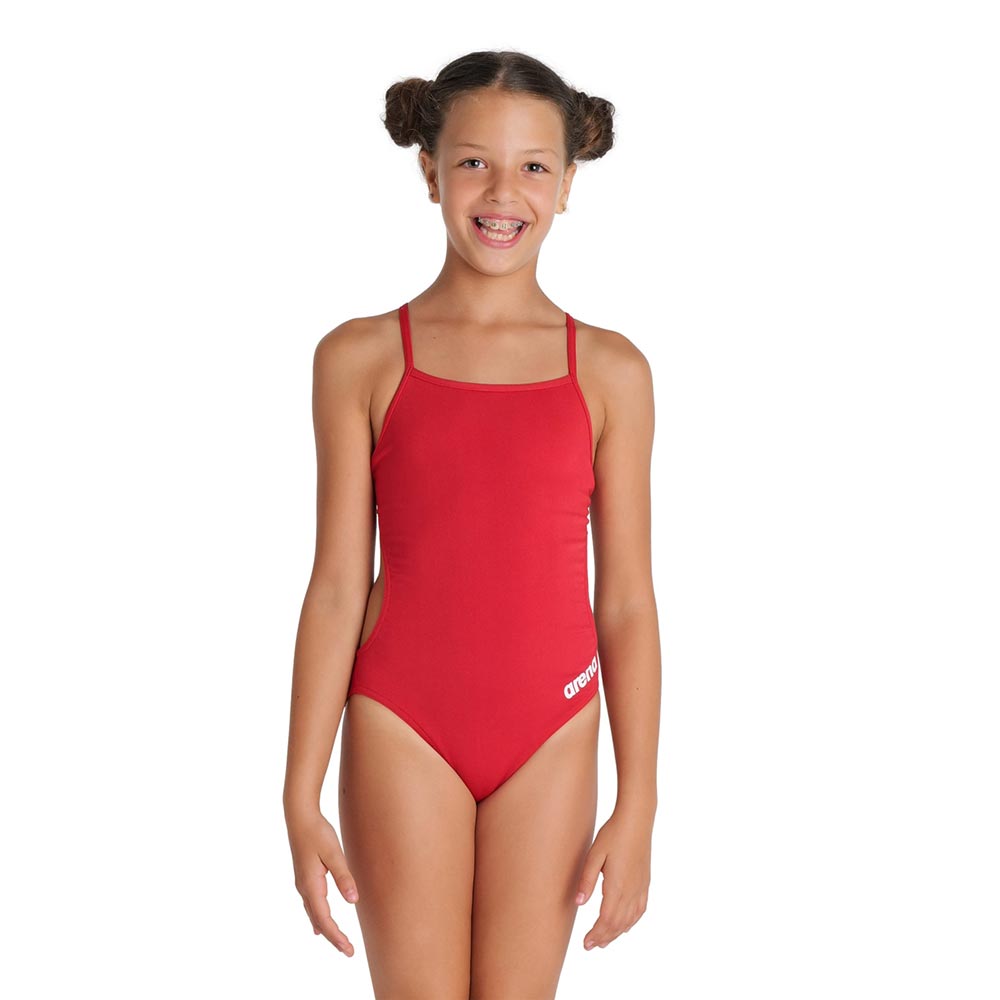 Girl wearing the arena girls team challenge back swimsuit in red.