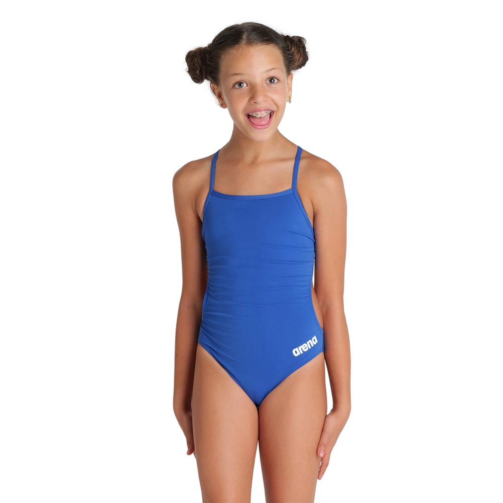 Girl wearing the arena girls team challenge back swimsuit in royal blue.