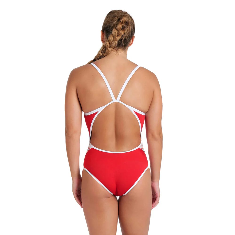 Back view of a woman wearing the arena icons one piece swimsuit in red.