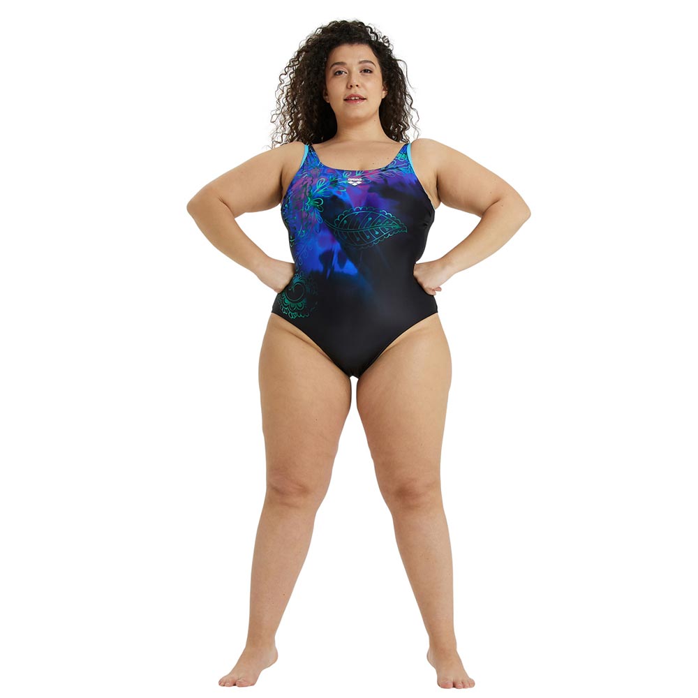 Woman modeling the arena womens flora plus one piece swimsuit.