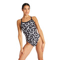 Woman wearing the arena lightning bolt pattern swimsuit.