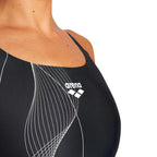 Close up of black arena swimsuit showing the arena logo printed on the chest.