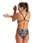 Back view of an arena swimsuit with pattern print and thin back straps.