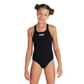 Young girl wearing a black arena team pro swimsuit with Arena logo in white.