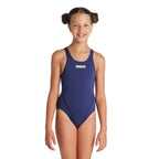 A girl in a navy arena swim tech swimsuit with arena logo printed in white.