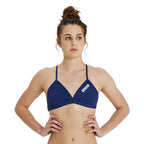 Woman wearing the arena team bikini top in navy.