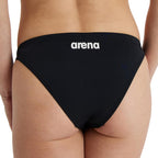 Back view of black arena womens team bikini bottoms with arena logo printed in white.