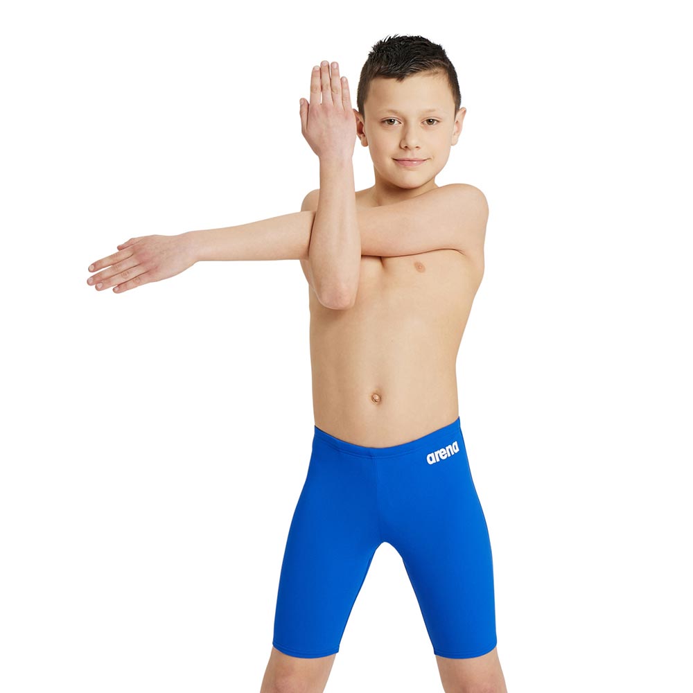 A boy wearing the arena boys team swim jammer in royal colour.