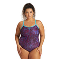Woman wearing an arena womens mountain plus size swimsuit with purple pattern and cyan straps.