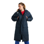 Arena unisex navy blue long padded parka jacket with hood, worn by a woman.
