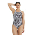 Front view of a woman wearing the arena allover one piece swimsuit.