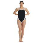 Woman wearing a black, arena swimsuit with white accents.