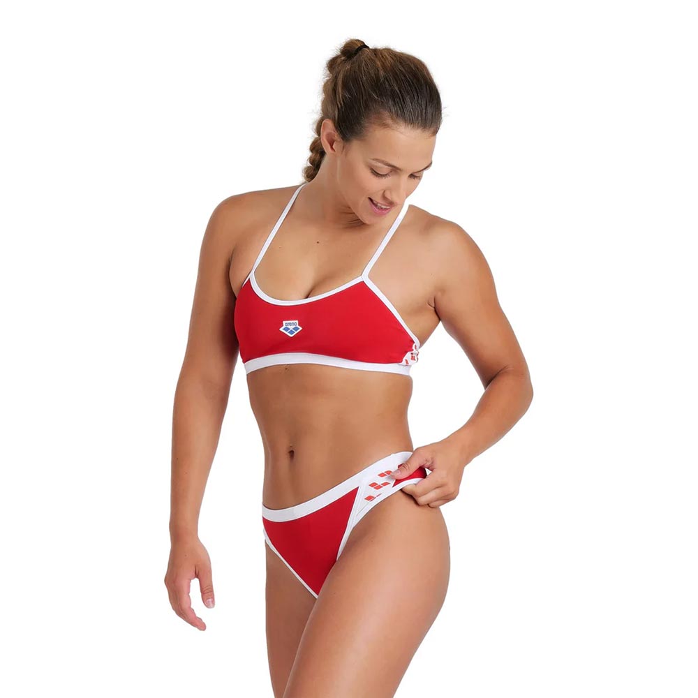 Woman wearing the arena icons bikini set in red.
