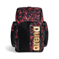 Arena Spiky III Swim Backpack 45L: Red and black flame-patterned backpack with gold "arena" logo