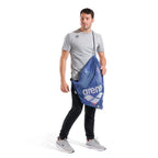Arena One Go Mesh Swim Bag 40L: Blue mesh bag with Arena logo, worn by a man