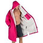 Dryrobe Advance Adults Change Robe in pink with a fluffy grey lining, worn open by a man