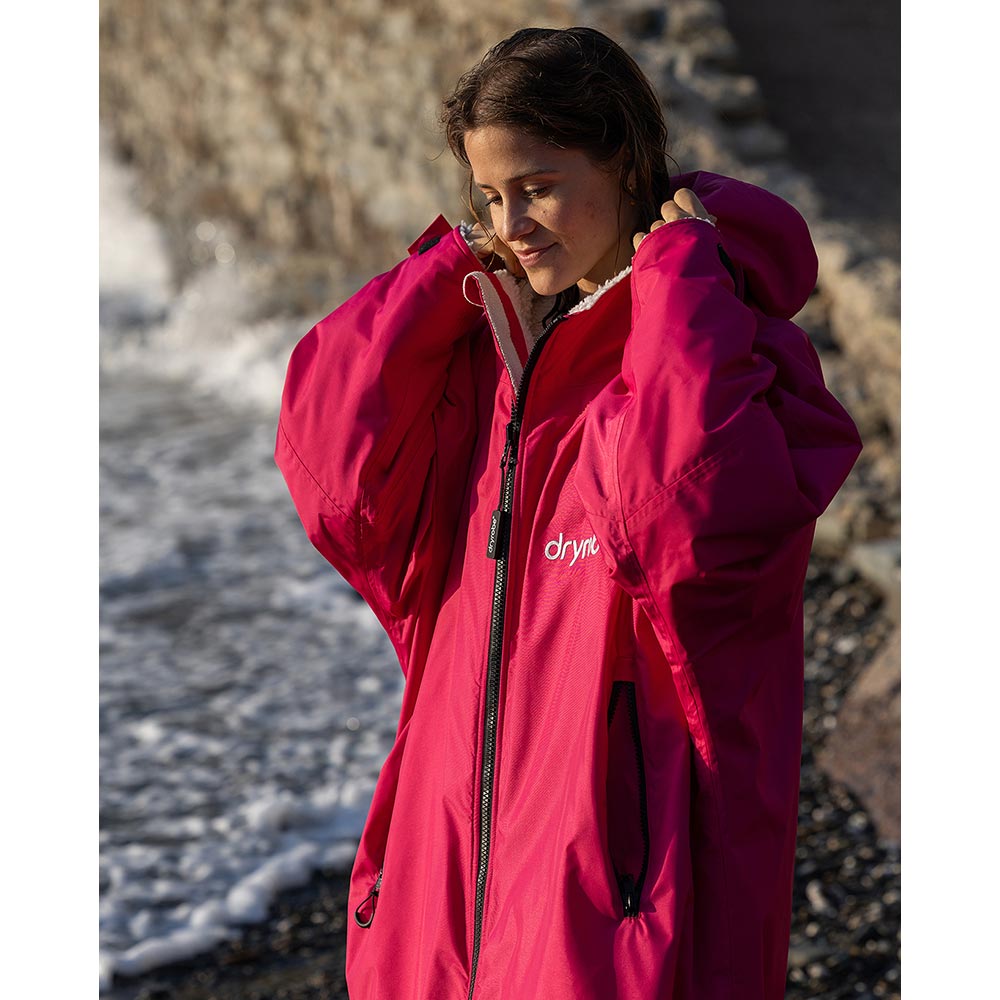 Dryrobe Advance Adults Change Robe in vibrant pink with a cosy light grey lining, perfect for outdoor adventures.