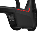 Close-up of black Suunto Wing 2 bone conduction headphones, showing red accents and control buttons